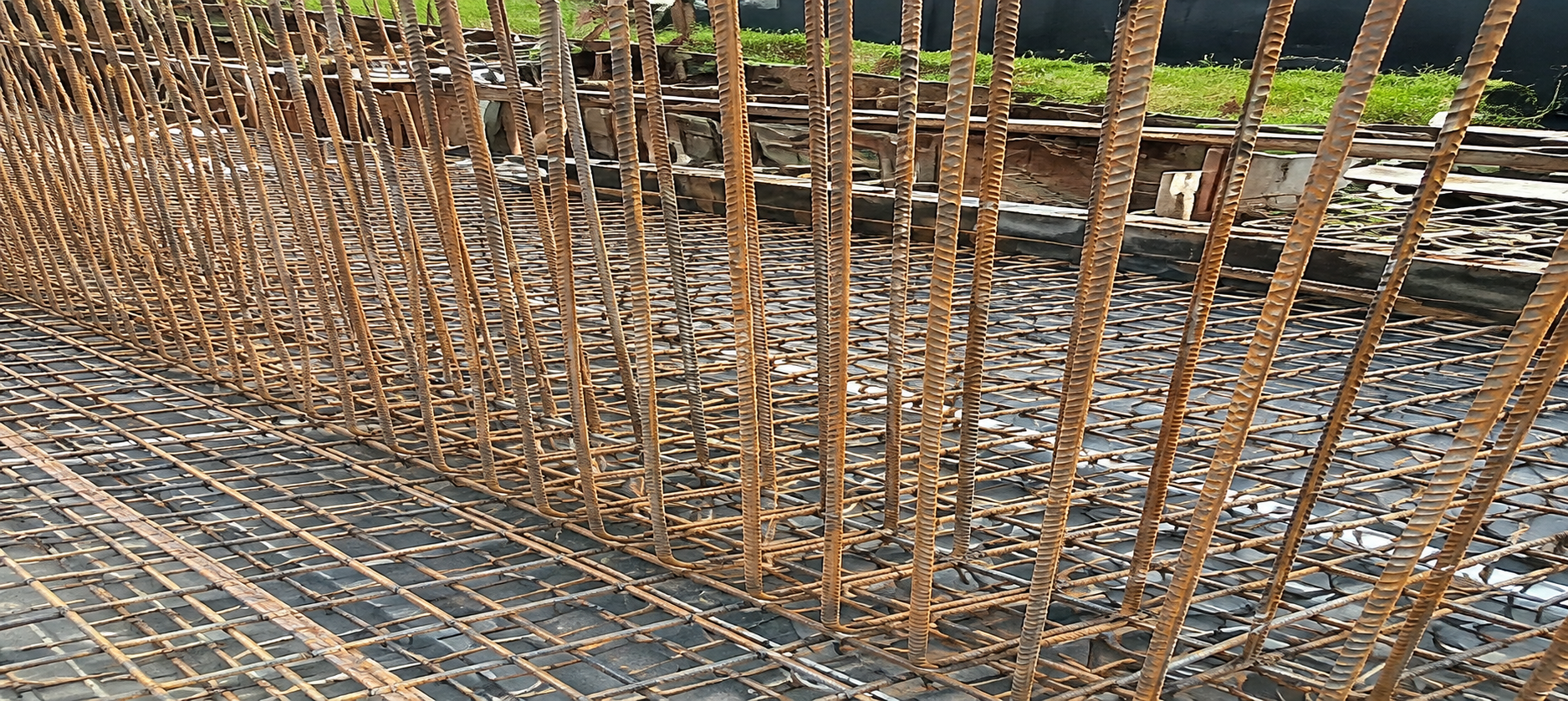 Anchor Grip membrane folded vertically against formwork at a basement wall junction